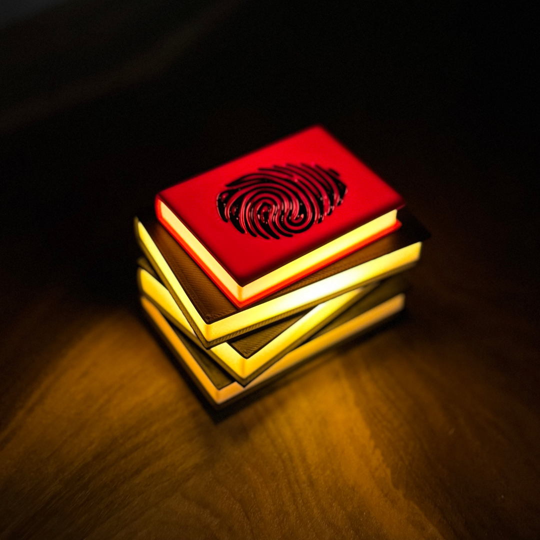 View of the True Crime Book Light glowing on a wooden shelf.